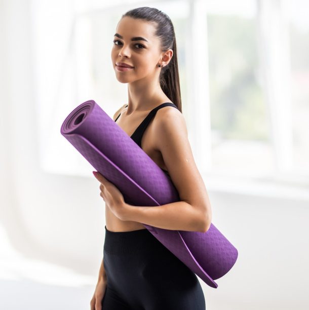 beautiful-young-woman-with-yoga-mat-gym-min (1)